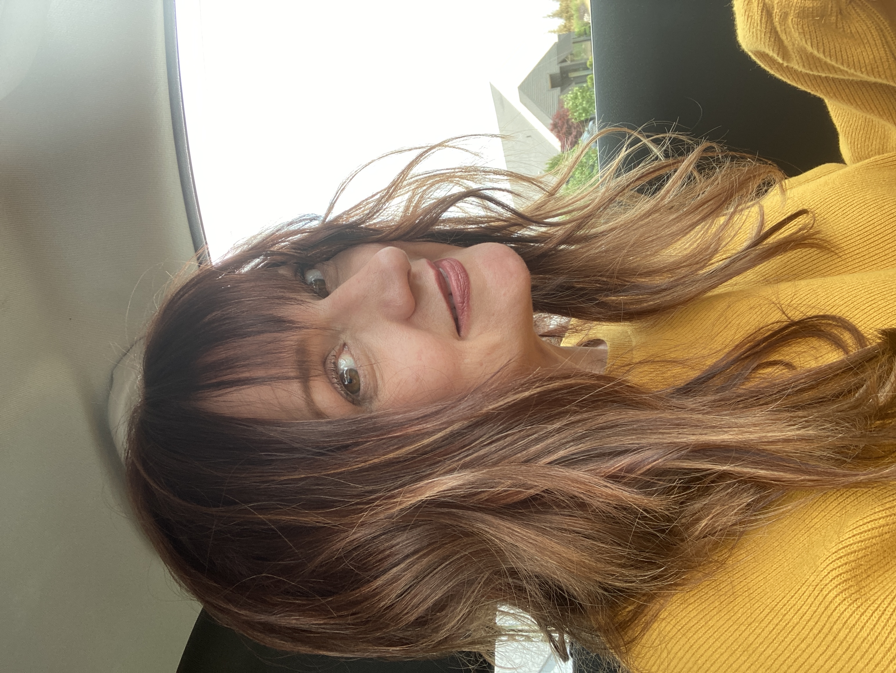 Narrator Amy McFadden in a yellow sweater
